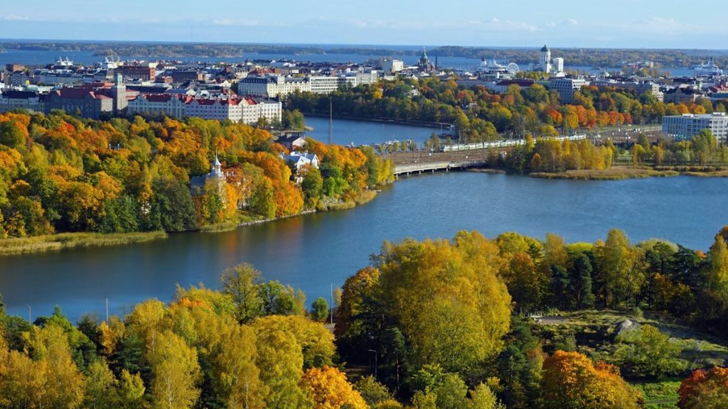 Autumn trees with the central city of Helsinki in the background. Picture dimensions 16x9, perfect for many desktop monitors.
